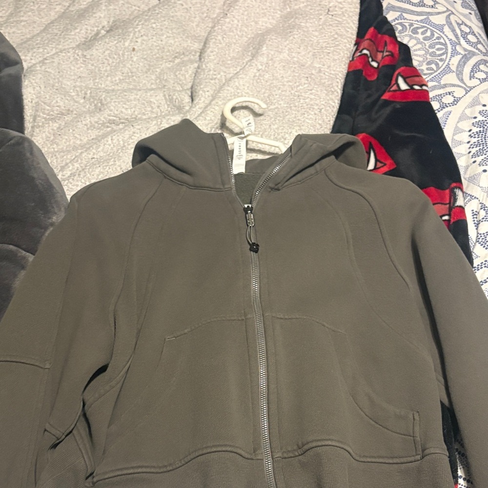 Lululemon zip up jacket, in the color green. Very warm and cozy